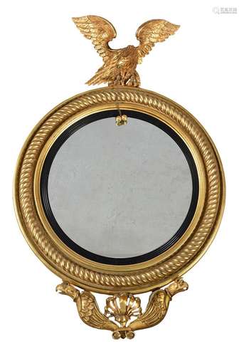 A REGENCY GILTWOOD CONVEX WALL MIRROR, CIRCA 1820