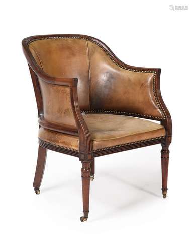 A REGENCY MAHOGANY AND LEATHER UPHOLSTERED LIBRARY ARMCHAIR,...