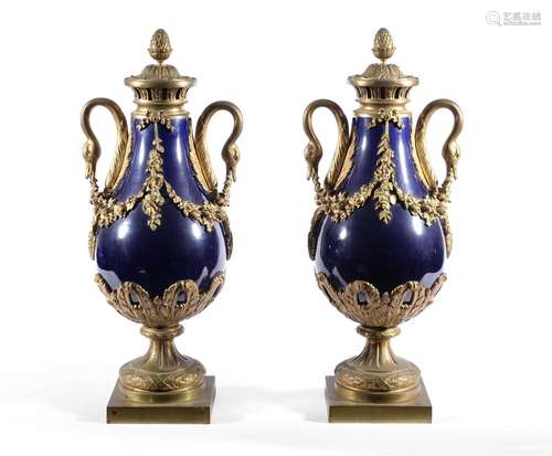 A PAIR OF FRENCH ORMOLU MOUNTED BLUE GLAZE VASES IN THE LOUI...