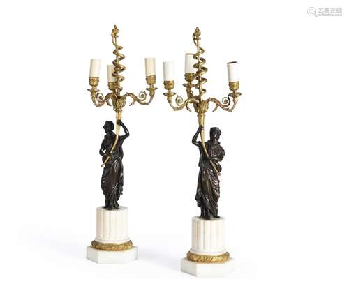 A PAIR OF FRENCH PARCEL GILT BRONZE AND MARBLE THREE LIGHT C...