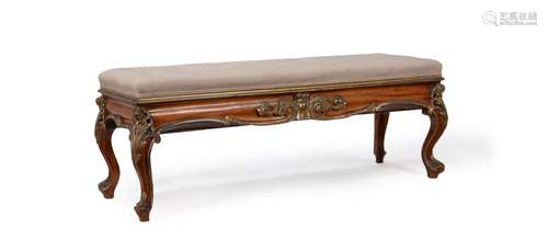 AN EARLY VICTORIAN WALNUT AND PARCEL GILT STOOL IN THE MANNE...