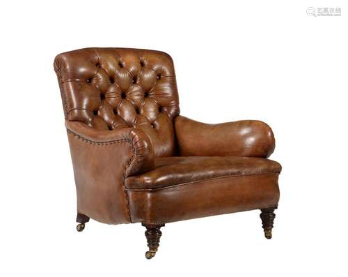 A LATE VICTORIAN BUTTONED LEATHER UPHOLSTERED ARMCHAIR IN TH...