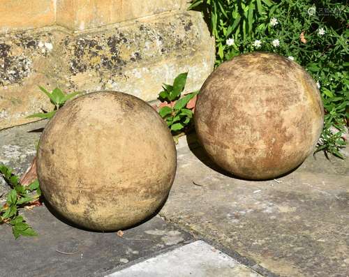 A PAIR OF TERRACOTTA BALLS, IN THE MANNER OF JOHN MARRIOTT B...