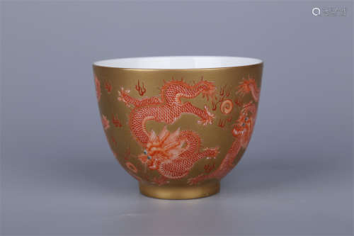 A Golden Glazed Porcelain Cup.