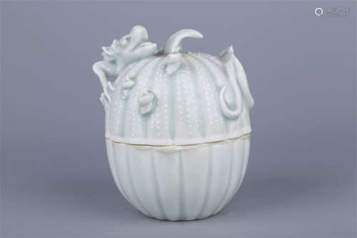 A Porcelain Lidded Box with Dragon Design.