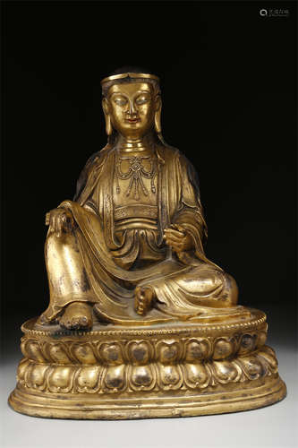 A Gilt Copper Guru Buddha Statue.