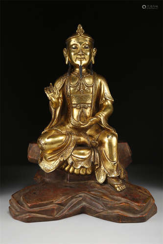 A Gilt Copper Buddha Statue.