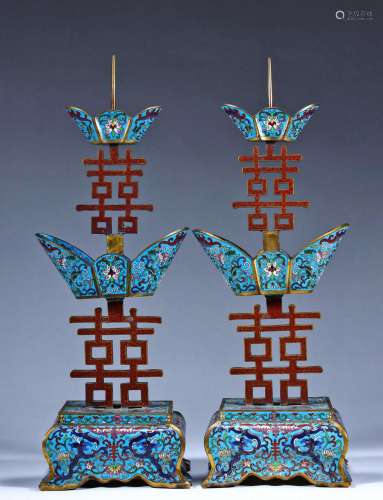 A PAIR OF QING QIANLONG Cloisonne candlesticks with two wing...