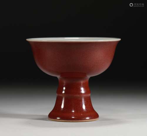 A Warring States period Ji-red glaze high foot cup