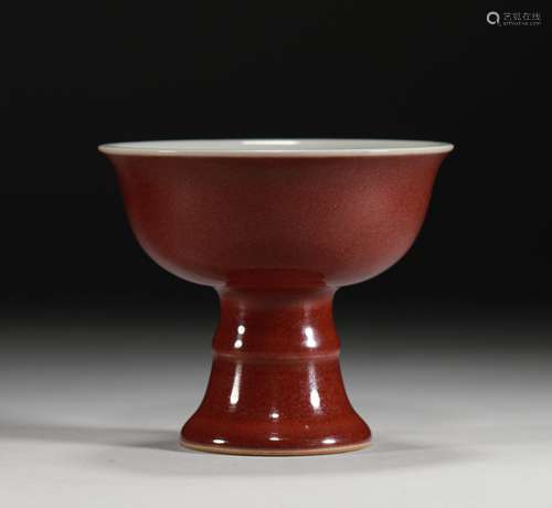 A Warring States period Ji-red glaze high foot cup