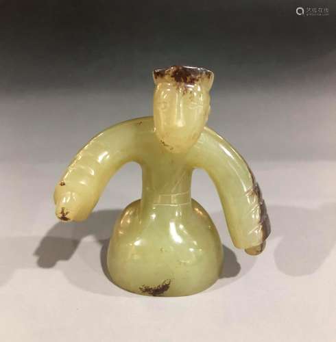 A HAN DYNASTY HETIAN WHITE JADE FIGURE