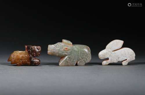 A SET OF WARRING STATES PERIOD HETIAN JADE BEASTS
