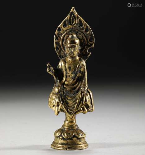 A TANG DYNASTY BRONZE GILT BUDDHA