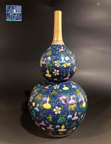 A QING DYNASTY BLUE GROUND ENAMEL GOURD BOTTLE