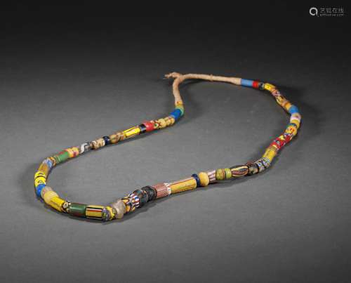 A STRING OF WARRING STATES PERIOD  colored glaze NECKLACE