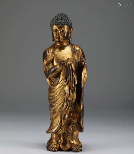 A MING DYNASTY BRONZE GILT Sakyamuni Buddha