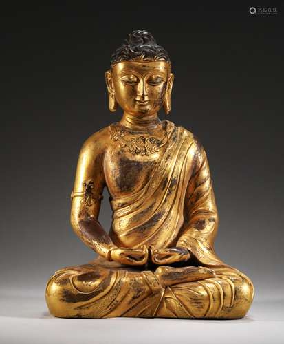 A MING DYNASTY BRONZE GILT DALI BUDDHA STATUE