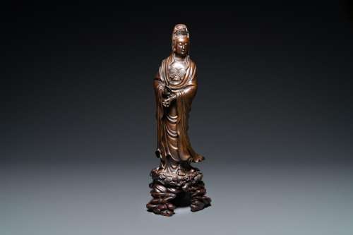 AN EXCEPTIONALLY LARGE CHINESE SILVER-INLAID BRONZE FIGURE O...