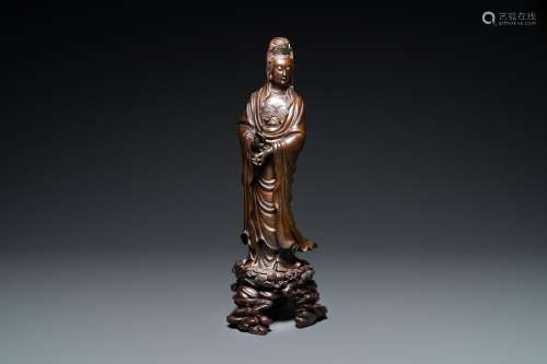 AN EXCEPTIONALLY LARGE CHINESE SILVER-INLAID BRONZE FIGURE O...