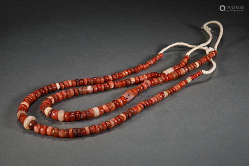 A STRING OF WARRING STATES PERIOD AGATE NECKLACE