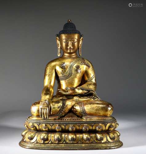 A MING DYNASTY BRONZE GILT Sakyamuni Buddha