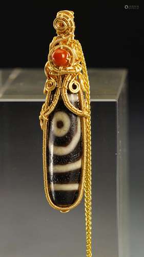 A TANG DYNASTY DZI WRAPPED GOLD