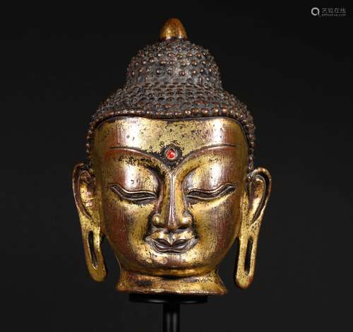 A MING DYNASTY BRONZE GILT BUDDHA'S HEAD