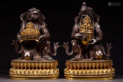 A PAIR OF BRONZE GILT Double protection statues