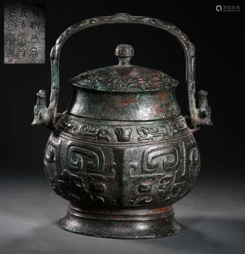 A WARRING STATES PERIOD BRONZE HANDLE POT