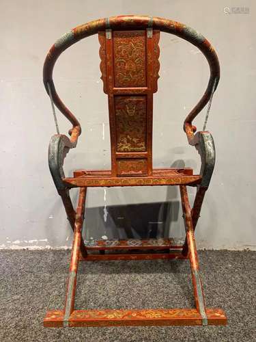 A QING DYNASTY CARVED DRAGON PATTERN FOLDING CHAIR