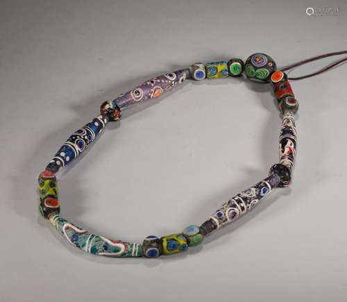 A STRING OF WARRING STATES PERIOD COLORED GLAZE NECKLACE