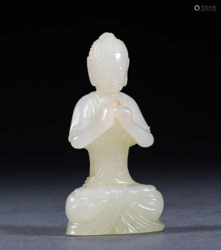 A MING DYNASTY HETIAN SEED MATERIAL BUDDHA STATUE