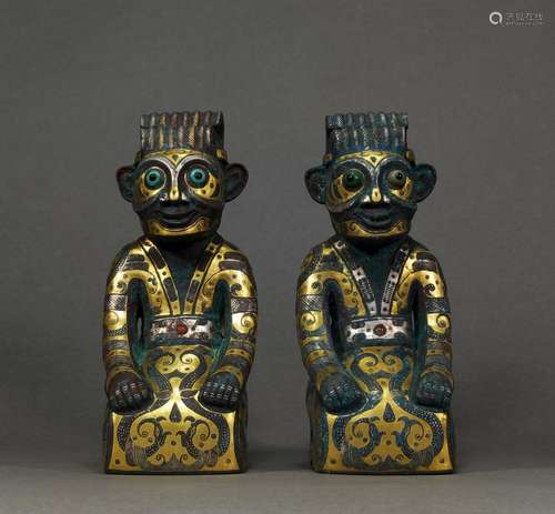 A PAIR OF WARRING STATES GOLD AND SILVER INLAID FIGURE DECOR...