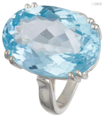 Sterling silver solitaire ring set with blue topaz.