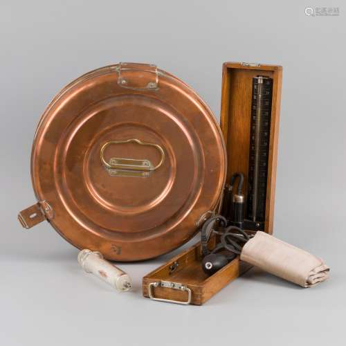 A round brass doctors instrument sterilisation box with glas...