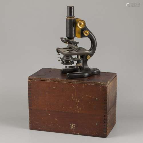 A "Spencer Lens Co." microscope in case, England, ...