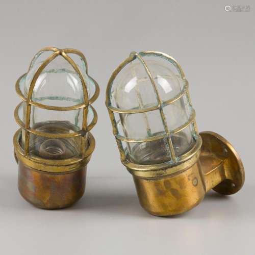 A lot comprising (2) various stormlamps/ cage lamps, 20th ce...