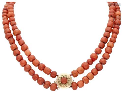 Two-row red coral necklace with a 14K. yellow gold closure.