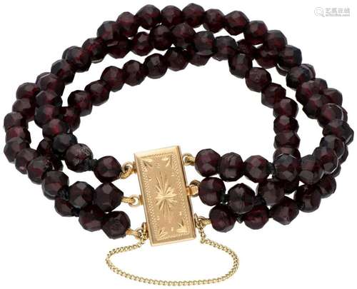 Three-row glass garnet bracelet with a 14K. yellow gold clos...