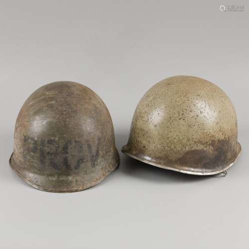 A lot comprising (2) various American helmets, a.w. WWII, 20...