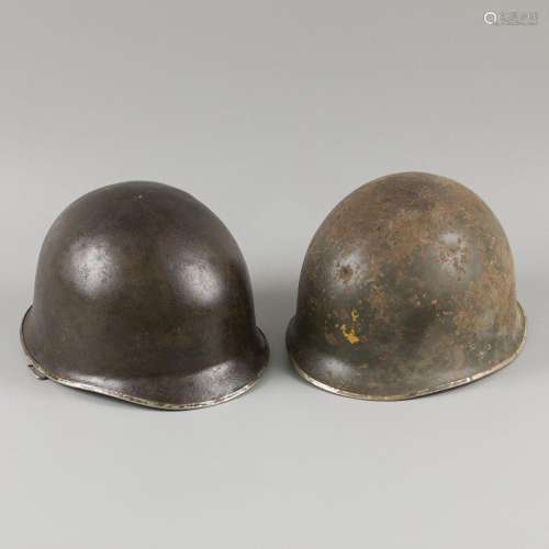 A lot comprising (2) various American navy helmets, with yel...