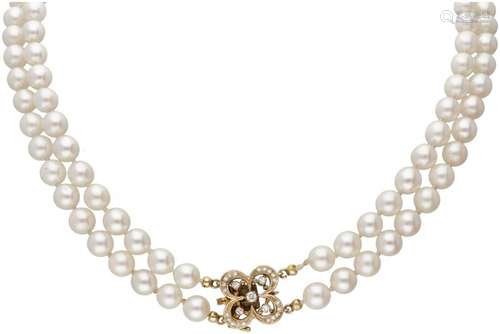 Two-row freshwater pearl necklace with a 20K. yellow gold cl...