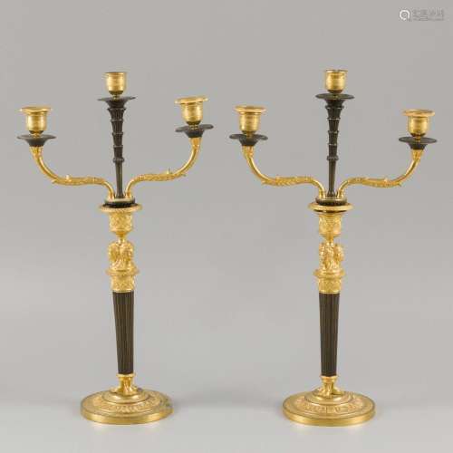 A set comprising (2) Empire candlesticks, France, early 19th...