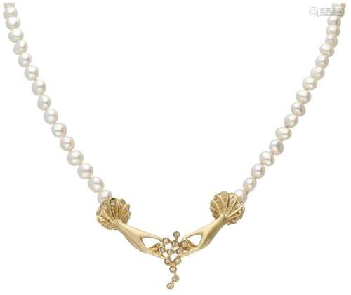 Vintage freshwater pearl necklace with a 10K. yellow gold ce...