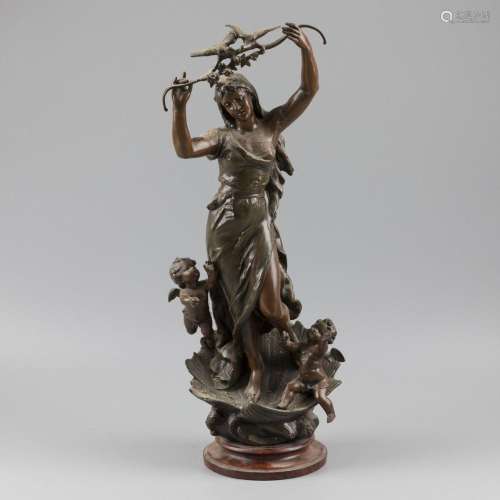 A ZAMAC cast of a young beauty holding a branch with love bi...