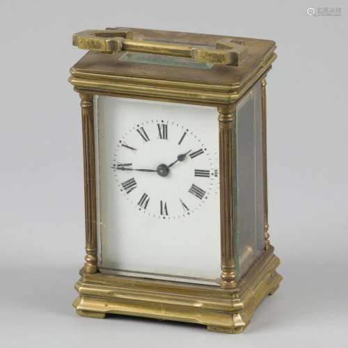 A brass so - called. "carriage clock".