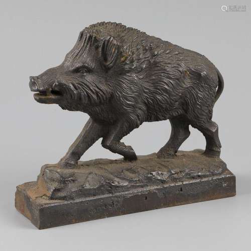 A cast iron doorstop in the shape of a wild boar.