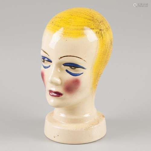 An art deco / flapper girl style hat stand in the shape of a...