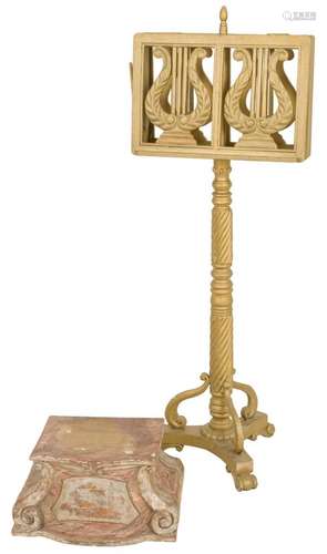 A gold painted eclesiastical music stand on turned stand. To...