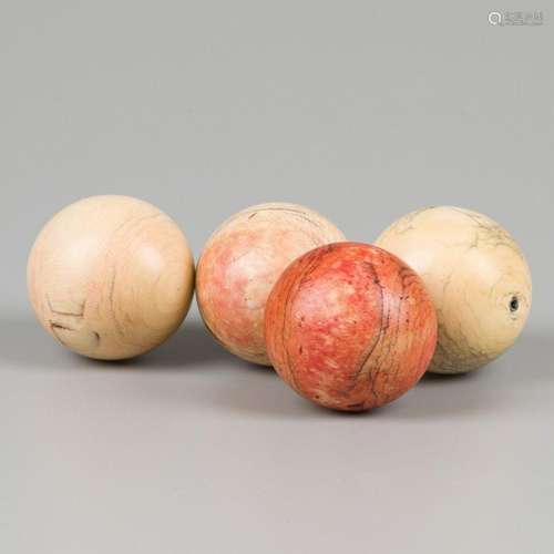 A lot comprising (4) ivory billiard balls, ca. 1900 - 1920.